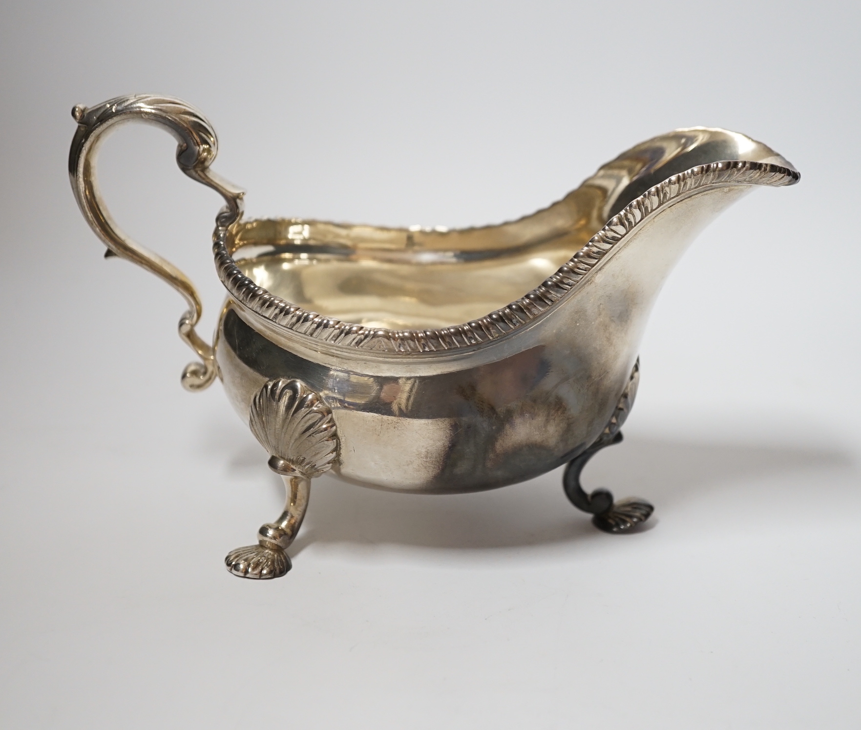 A George III silver sauce boat, maker's mark rubbed, London, 1761, 19.2cm, 12.6oz.